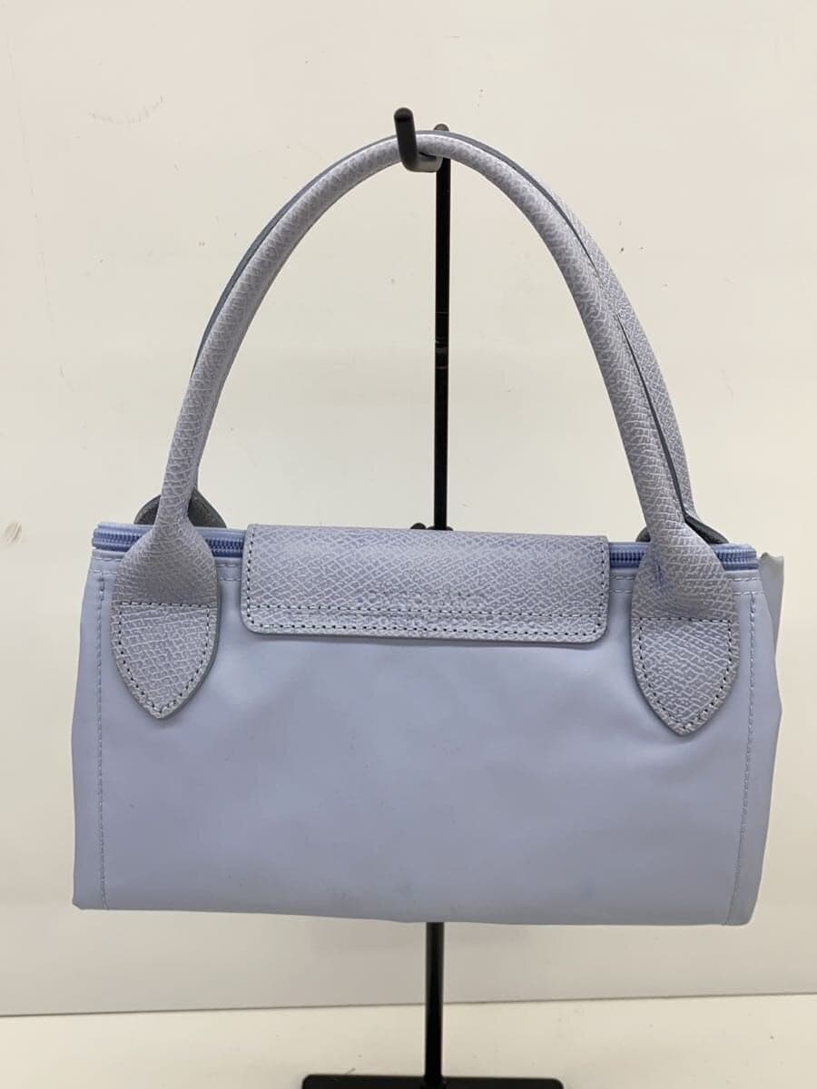 There are stains on the inside of the LONGCHAMP. 3