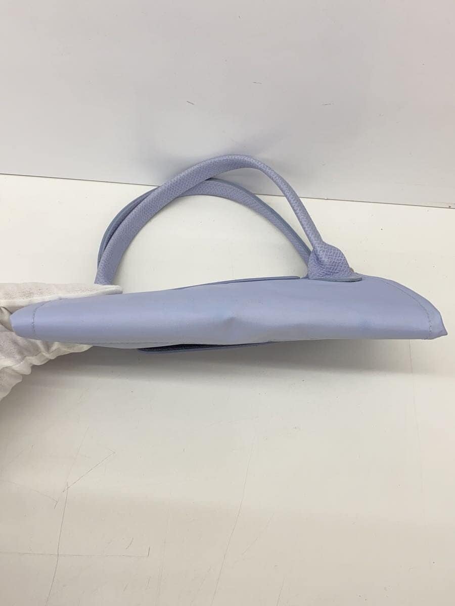 There are stains on the inside of the LONGCHAMP. 4