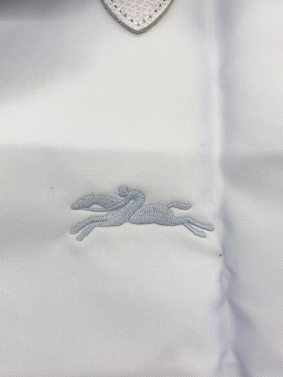 There are stains on the inside of the LONGCHAMP. 5