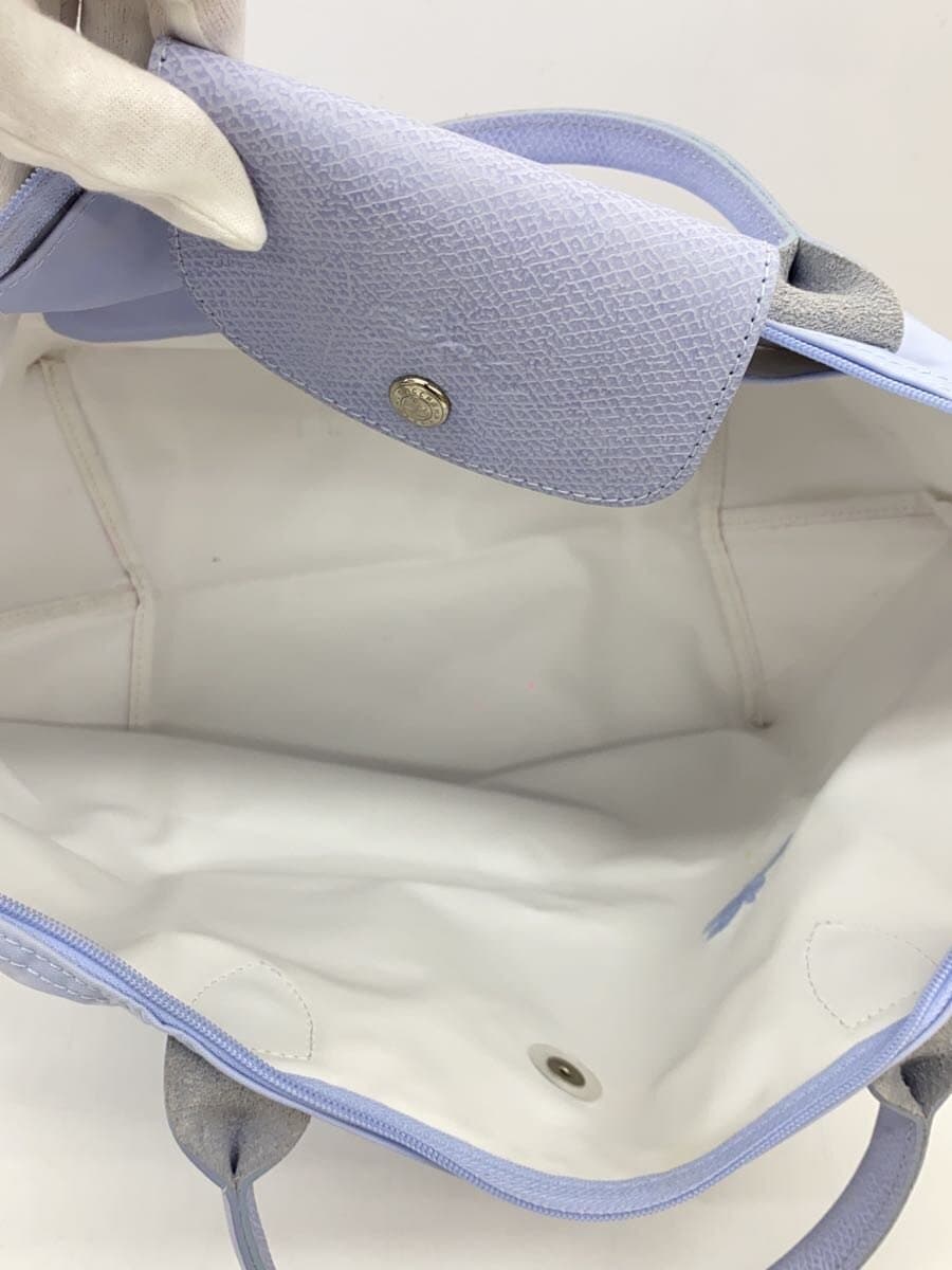 There are stains on the inside of the LONGCHAMP. 6