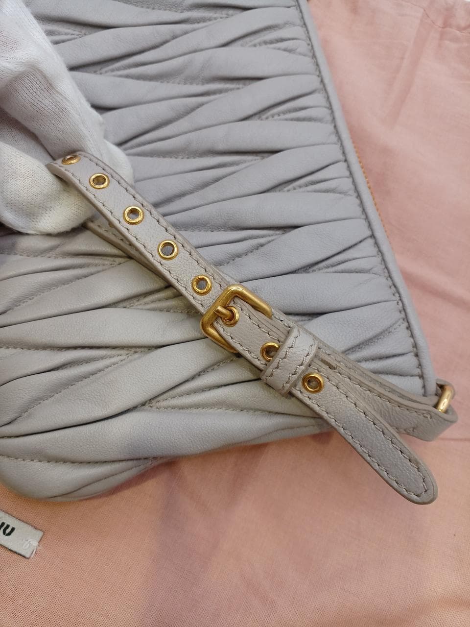 Matelassé clutch bag in greige 10