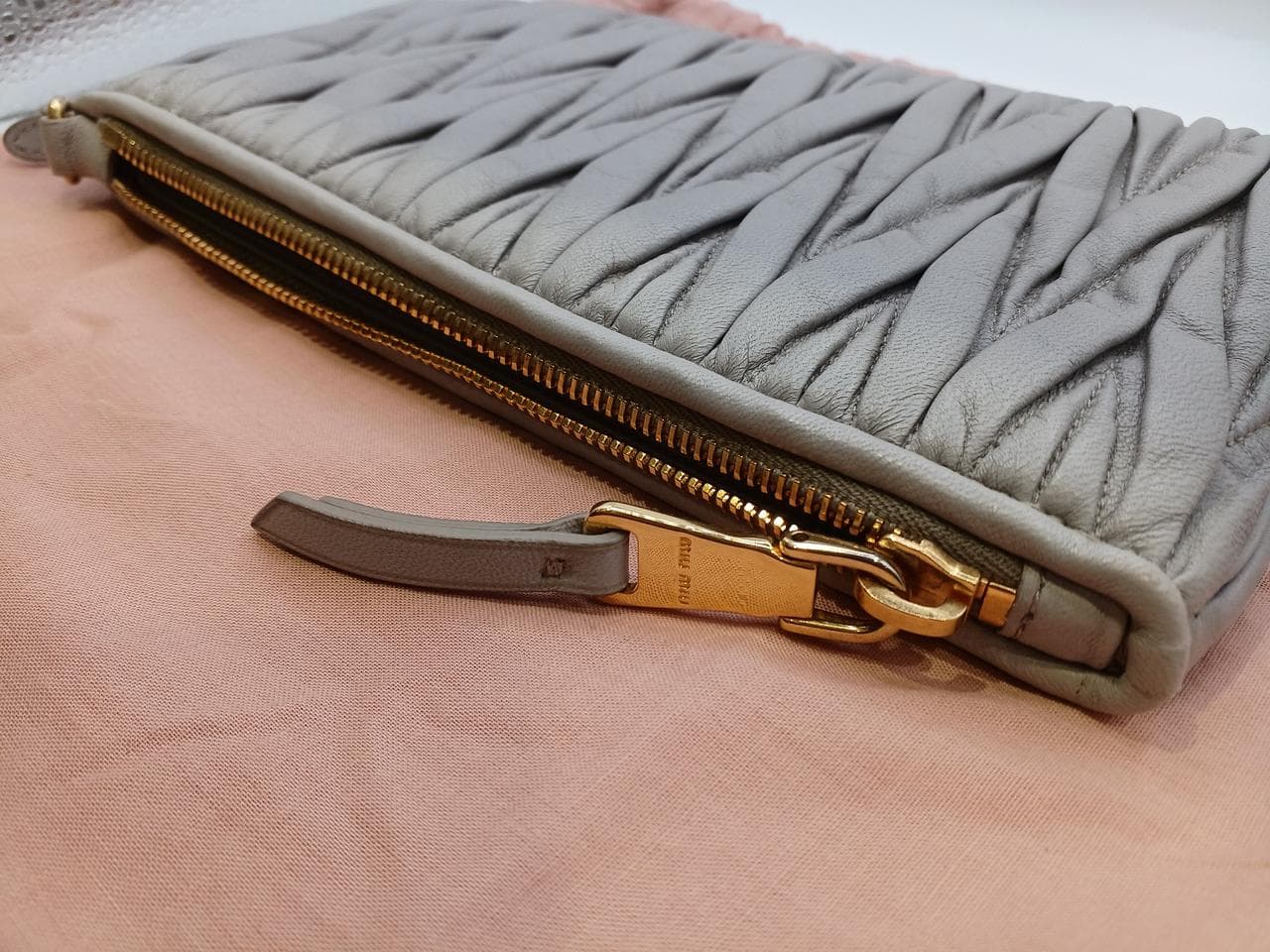 Matelassé clutch bag in greige 11