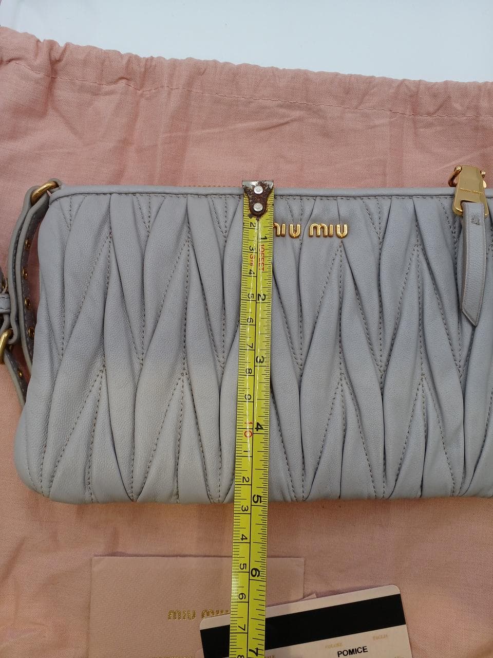 Matelassé clutch bag in greige 14