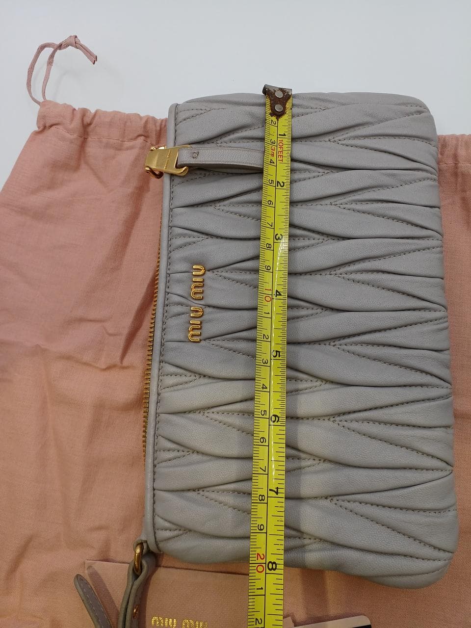 Matelassé clutch bag in greige 15