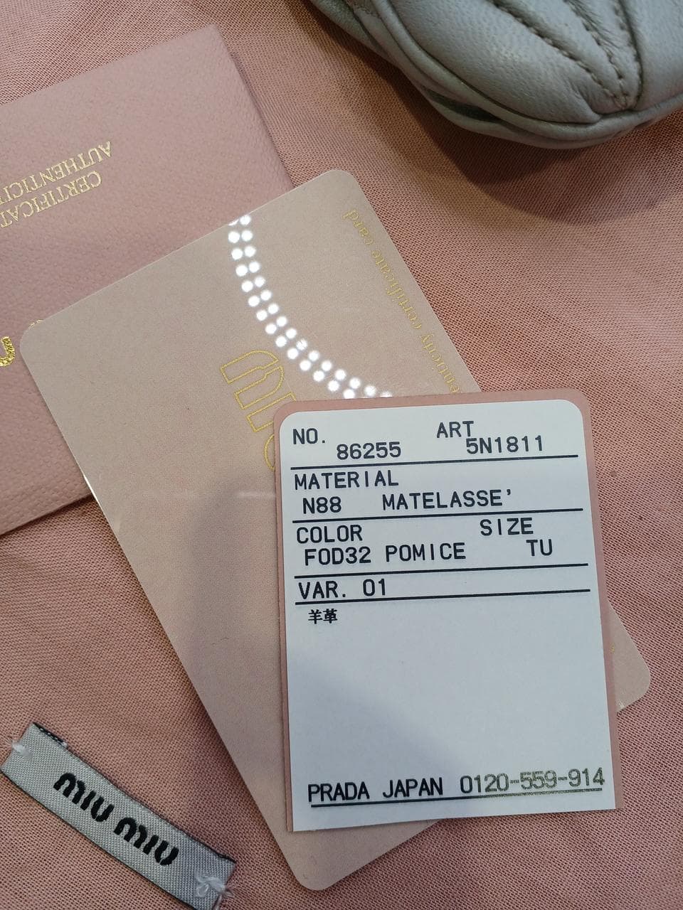 Matelassé clutch bag in greige 16