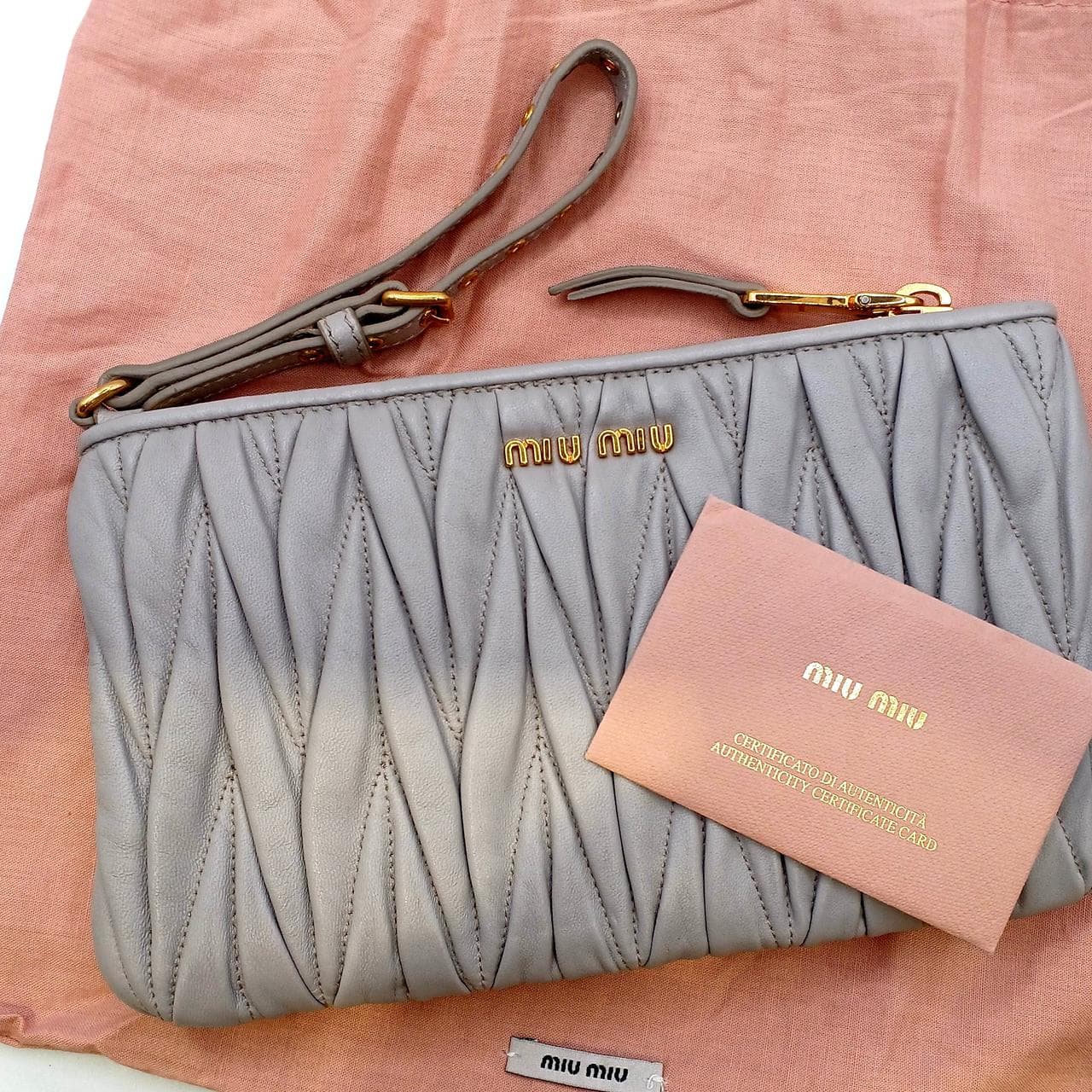 Matelassé clutch bag in greige