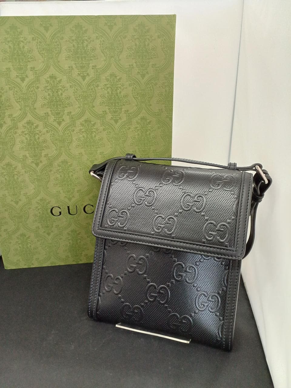 GG Embossed Messenger Bag 625782
